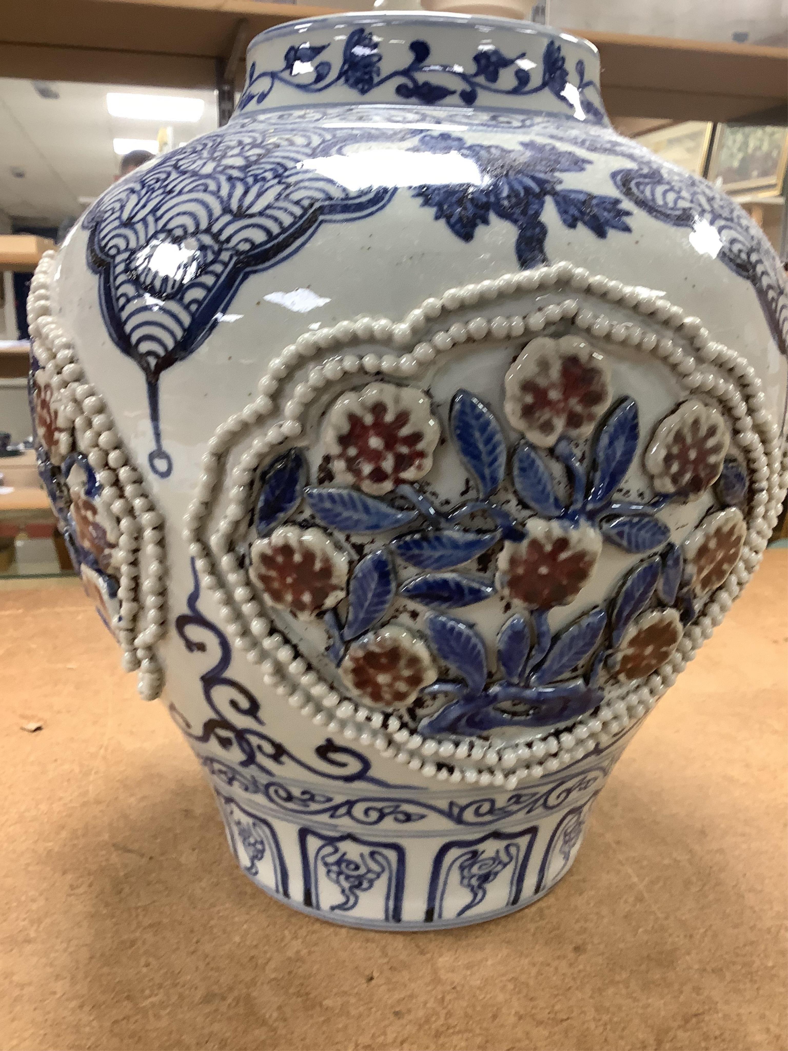 A Chinese underglaze blue and copper red lamp, two crackle glaze vases and a studio pottery bottle, largest 29cm high. Condition - fair